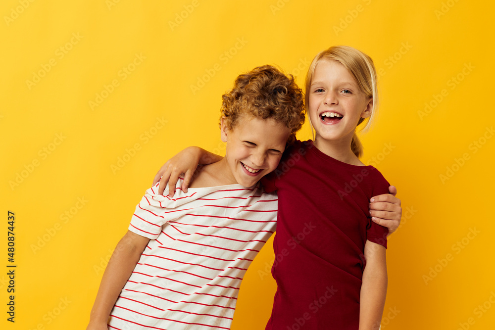 two joyful children casual wear games fun together isolated background two joyful children casual wear games fun together isolated background