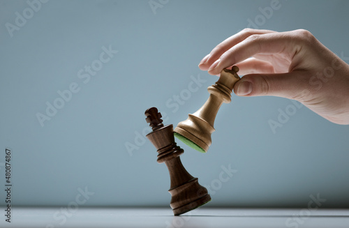 Fototapeta Player defeating his opponent and winning at chess