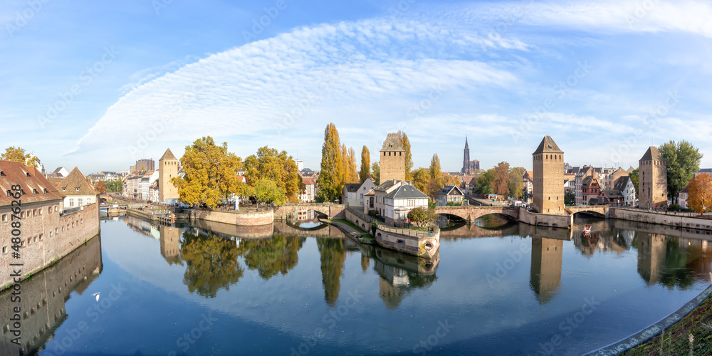 La Petite France with bridge over river Ill water tower panorama copyspace copy space Alsace in Strasbourg, France