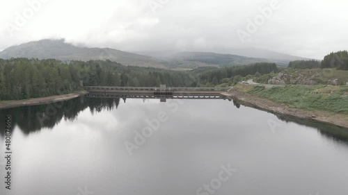 Flying backwards looking at Laggan Dam, located on the River Spean south west of Loch Laggan in the scottish highlands. photo
