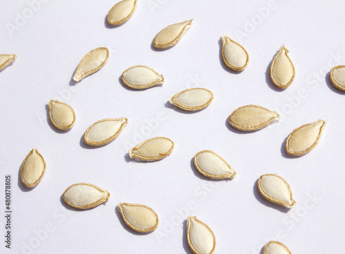 Heap of pumpkin seeds isolated on white background