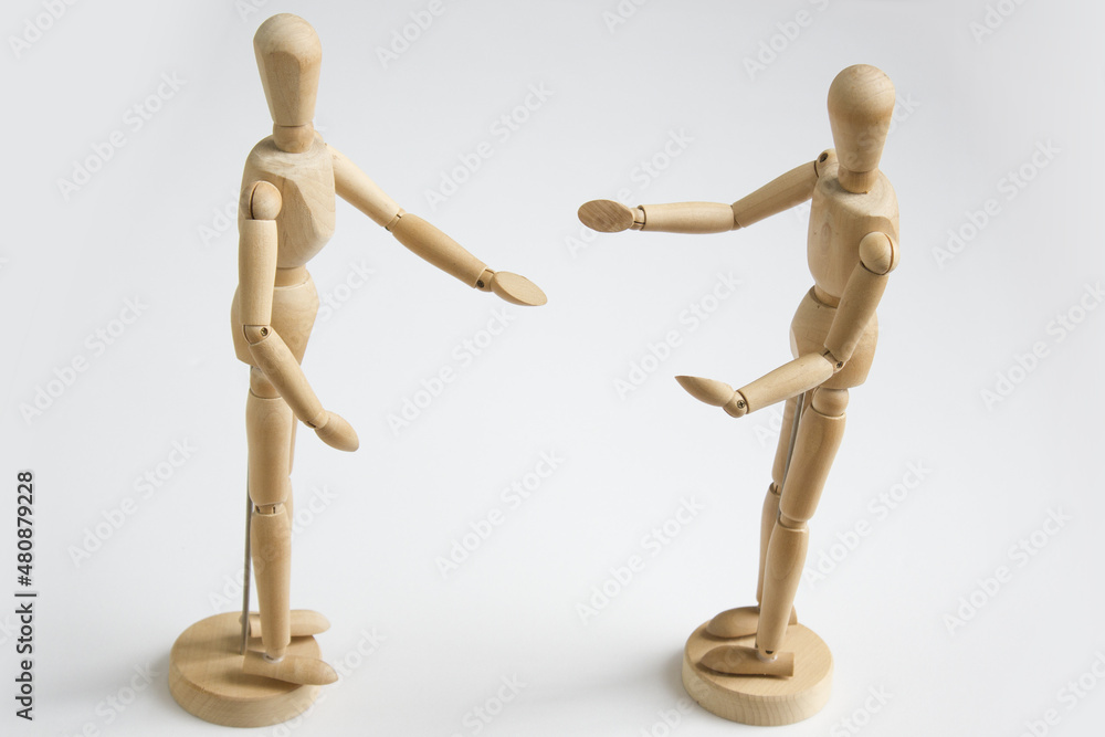 Talking wooden dolls. Isolated on white background. Talking wooden dolls. Isolated on white background.