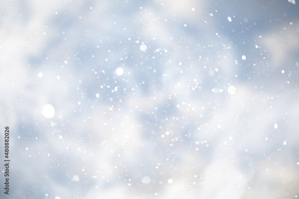 blue snowfall bokeh background, abstract snowflake background on blurred abstract blue