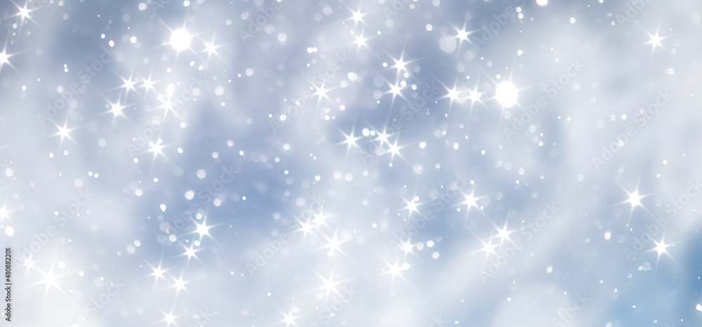 Fototapeta premium blue snowfall bokeh background, abstract snowflake background on blurred abstract blue