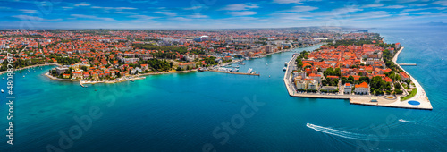 Zadar, Croatia - Aerial panoramic view of the old town of Zadar by the Adriatic sea with motorboat, yacht harbor and blue sky on a bright summer day