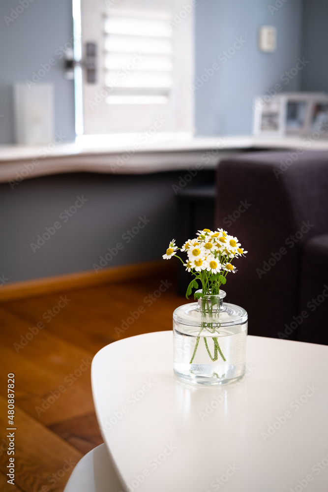 Table with flowers in  living room