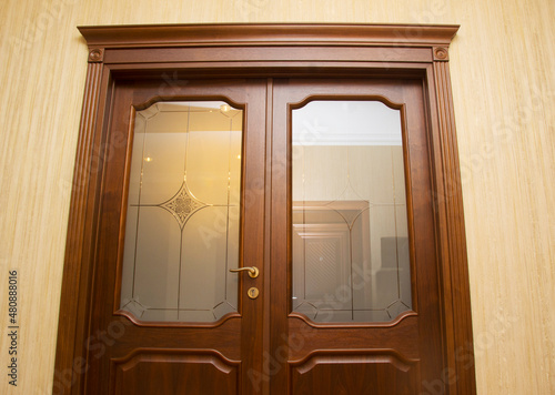 Close up of closed wooden door in the empty room