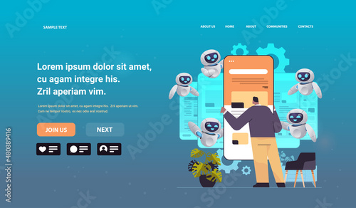 man and robot web developers creating program code on smartphone screen development of software and programming