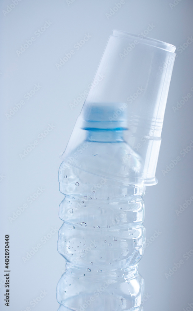 plastic bottle of water withplastic cup plastic bottle of water withplastic cup