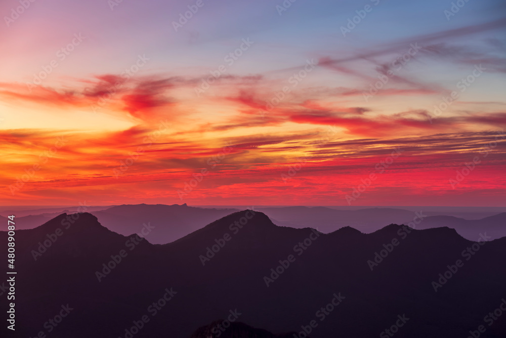 Australia, Victoria, Silhouettes of mountains seen from Mount William at moody sunset Australia, Victoria, Silhouettes of mountains seen from Mount William at moody sunset