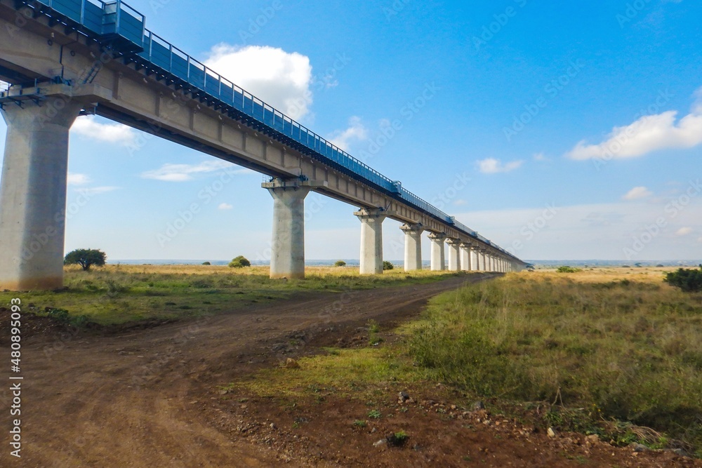 Fototapeta premium Scenic view of the Nairobi Mombasa Standard Gauge Railway line seen from Nairobi National Park, Kenya