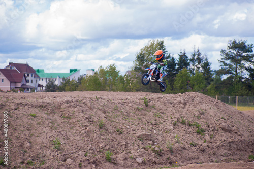 Belarus, Minsk / BLR - May 18nd 2015 : Competition of children on a motorcycle. Jumping on a motorcycle in the air.