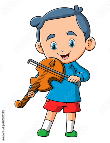 The happy boy is playing and rubbing violin with the stick