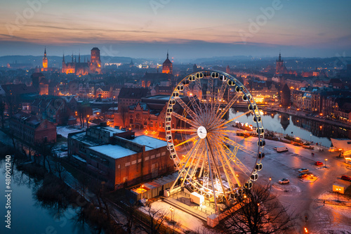 Beautiful sunset over the Gdansk city with illuminated ferris wheel, Poland © Patryk Kosmider
