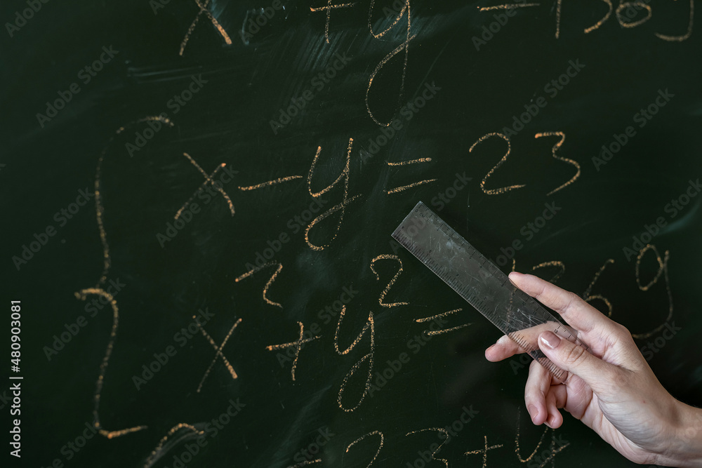female hand writing math formulas on the classboard Stock Photo | Adobe ...