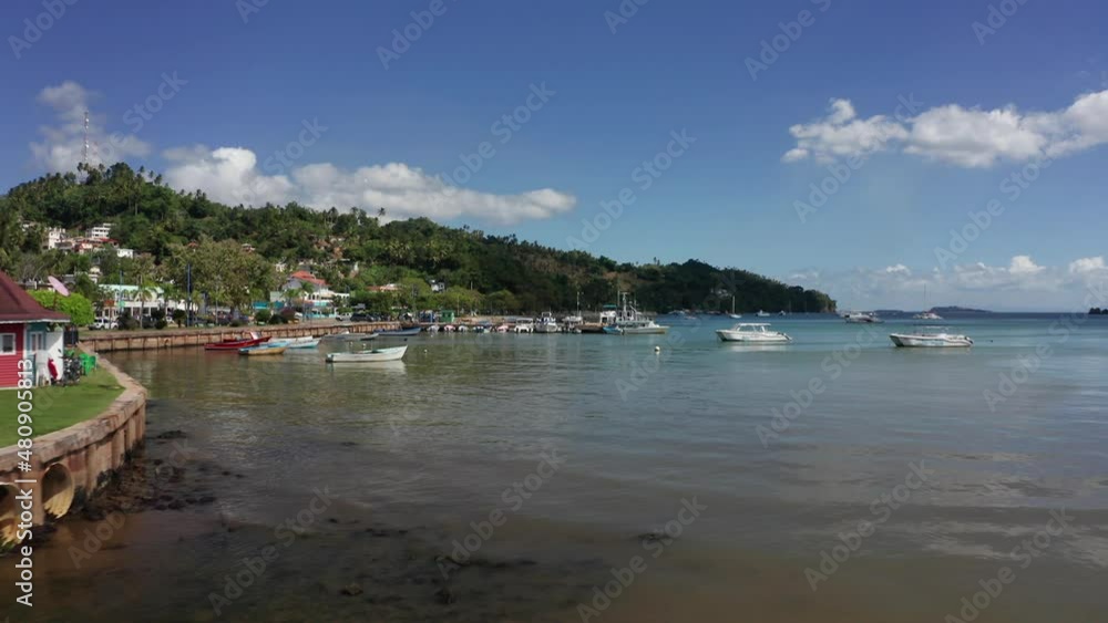 Drone flying over sea waters of Santa Barbara de Samana tourist port, Dominican republic. Aerial forward Drone flying over sea waters of Santa Barbara de Samana tourist port, Dominican republic. Aerial forward