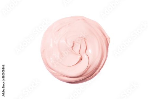 Pink cream texture round swatch isolated on white background. Cosmetic or beauty product texture.