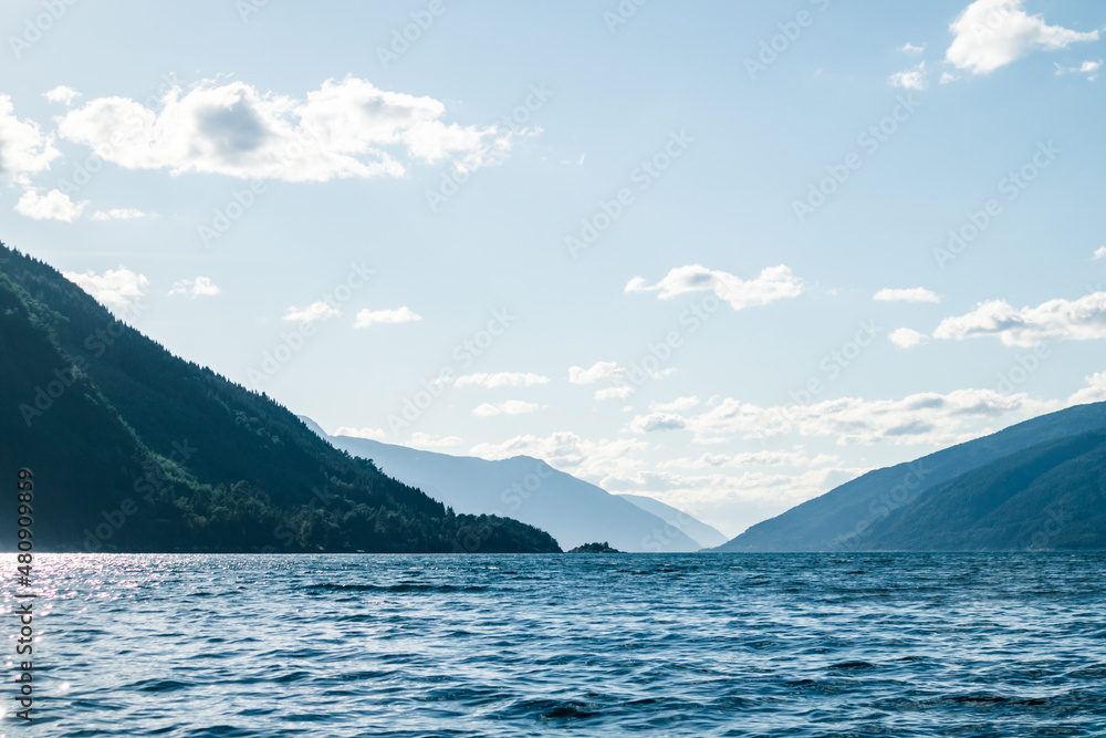 A beautiful view of the Norway fjord from the sea level. Autumn landscape of fjords in Northern Europe.