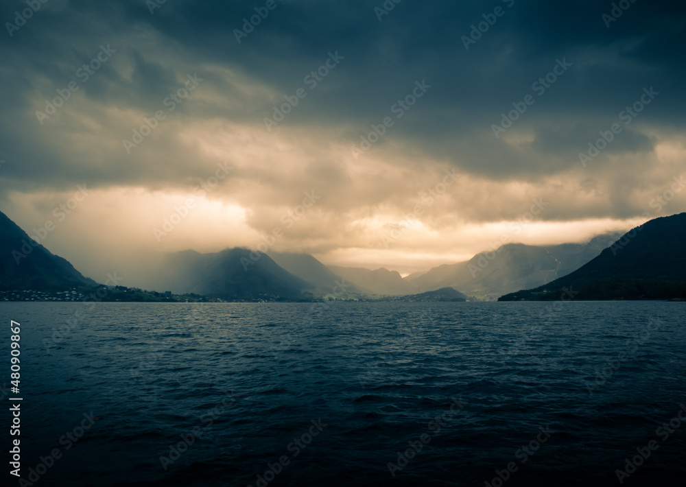 A beautiful view of the Norway fjord from the sea level. Autumn landscape of fjords in Northern Europe.