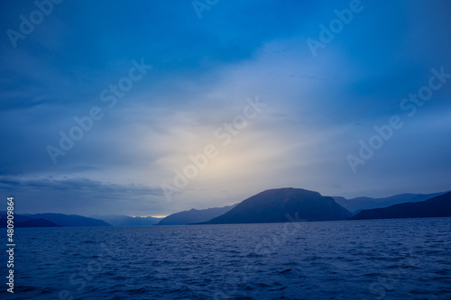 A beautiful view of the Norway fjord from the sea level. Autumn landscape of fjords in Northern Europe. © dachux21