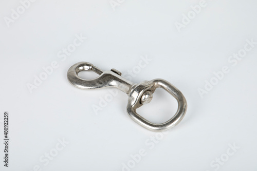 Stainless steel construction carabiner isolated on white background © Rza