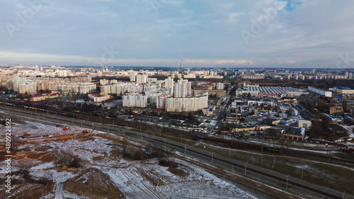 Flight on the outskirts of the city. Snow covered earth. Aerial photography. © f2014vad
