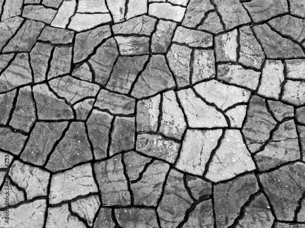 brick pattern texture on the floor in the park It looks like cracked soil gives a feeling of drought. The background gives a feeling of drought. brick pattern texture on the floor in the park It looks like cracked soil gives a feeling of drought. The background gives a feeling of drought.