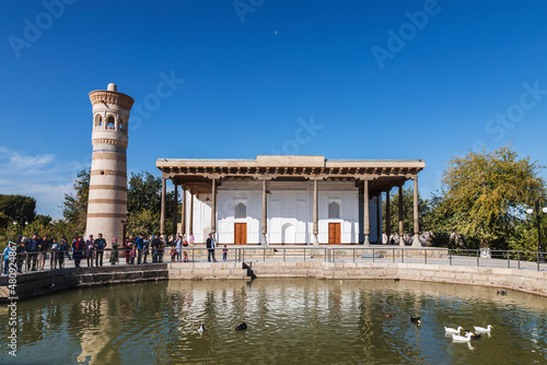 View of the building of the memorial complex of Bahauddin Nakshbandi. Muslim pilgrimage center and a pond in front of it. Suburb of Bukhara, Uzbekistan photo