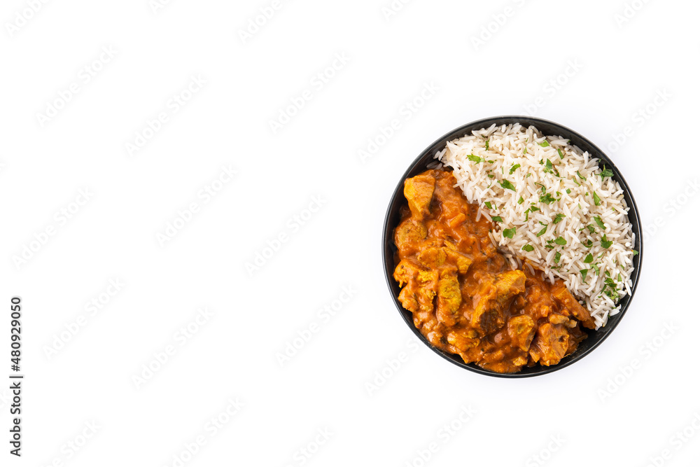 Indian butter chicken in black bowl isolated on white background. Top view. Copy space Indian butter chicken in black bowl isolated on white background. Top view. Copy space