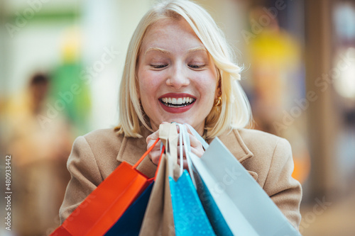 Portrait of surprised shocked blond hair girl travel trip see sales black friday go shopping feel crazy wear style outfit trousers isolated bright Shopping mall background