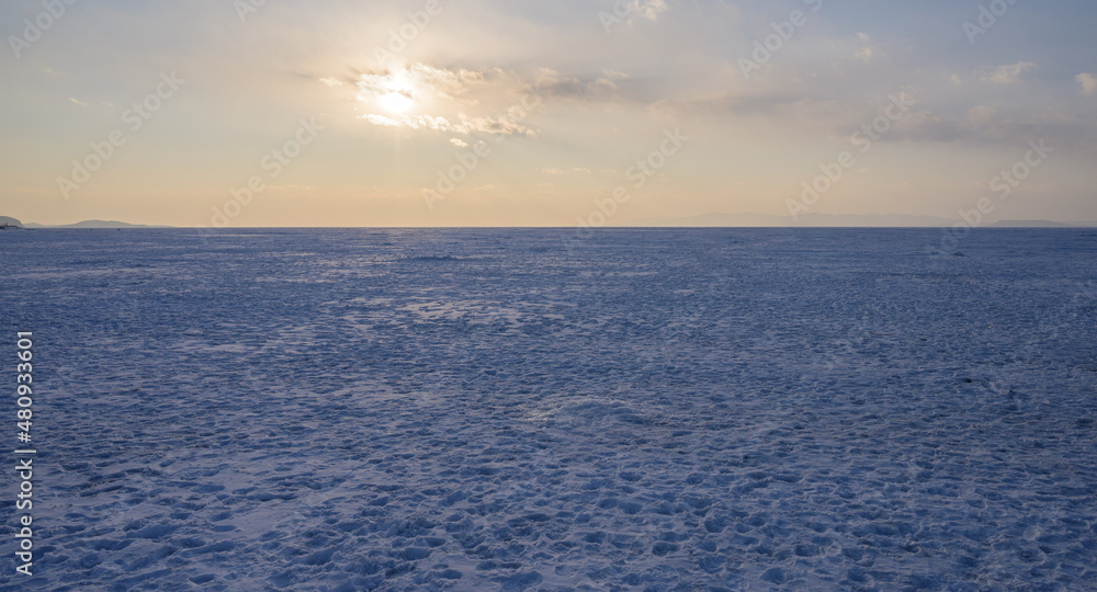 Obraz premium Frozen sea view at sunset.