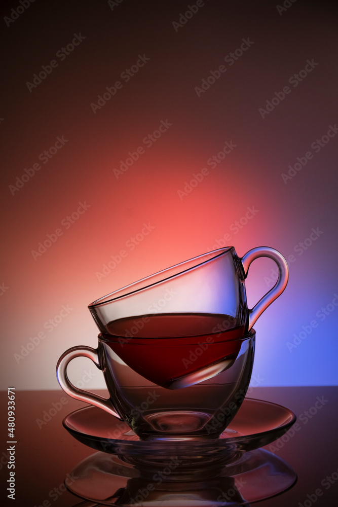 Two cups of tea against colorful background Two cups of tea against colorful background