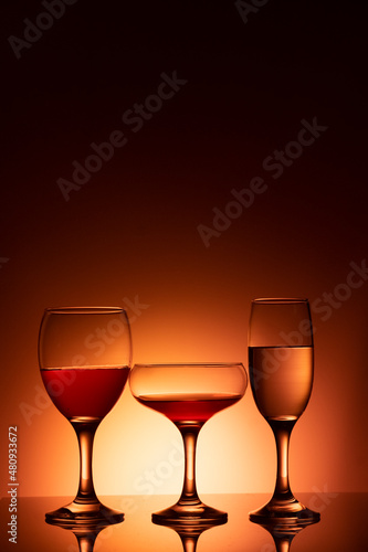 Glassware of different sizes against colorful background