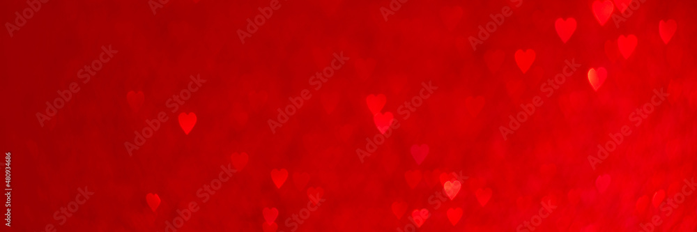 Red hearts, sparkling glitter bokeh background texture. Holiday valentines day lights. Abstract defocused header. Wide screen wallpaper. Panoramic web banner with copy space for design Red hearts, sparkling glitter bokeh background texture. Holiday valentines day lights. Abstract defocused header. Wide screen wallpaper. Panoramic web banner with copy space for design