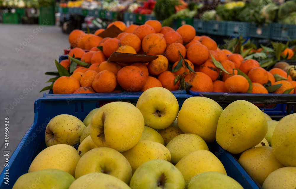 Golden apples displayed at a street stall