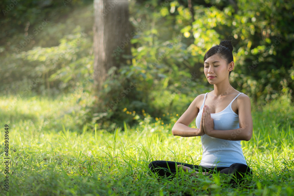 asian woman playing yoga in waterfall outdoor nature background. asian woman playing yoga in waterfall outdoor nature background.