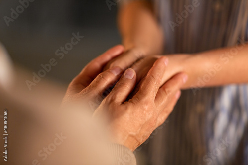 people, family and charity concept - close up of women holding hands © Syda Productions