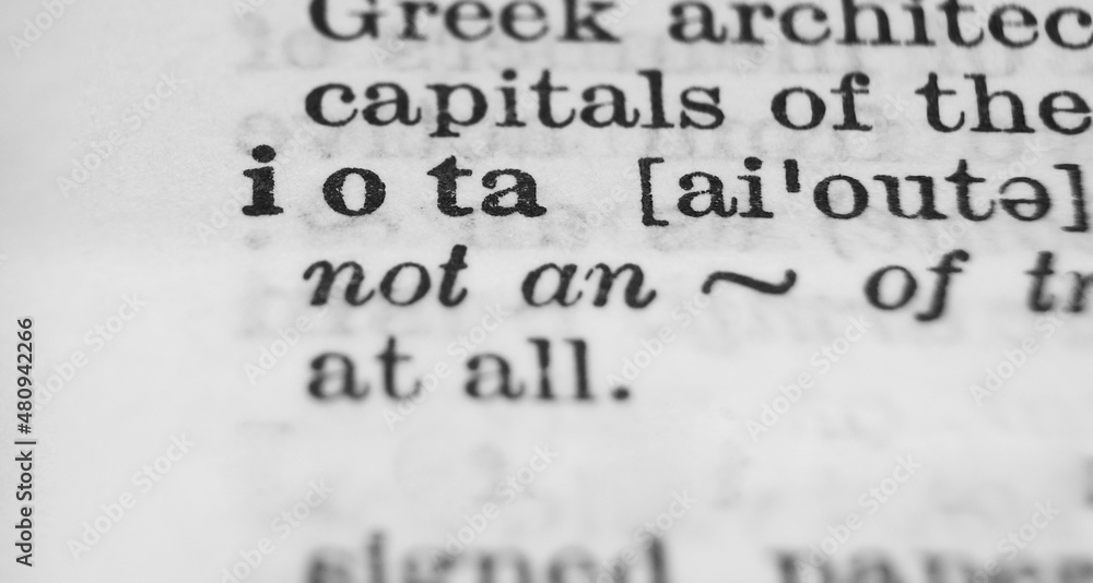 Greek letter Iota dictionary definition close-up. Shallow depth of field. Greek letter Iota dictionary definition close-up. Shallow depth of field.