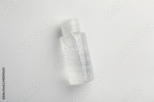 Bottle of cosmetic gel on white background, top view