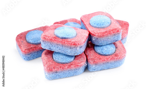 Pile of dishwasher detergent tablets on white background