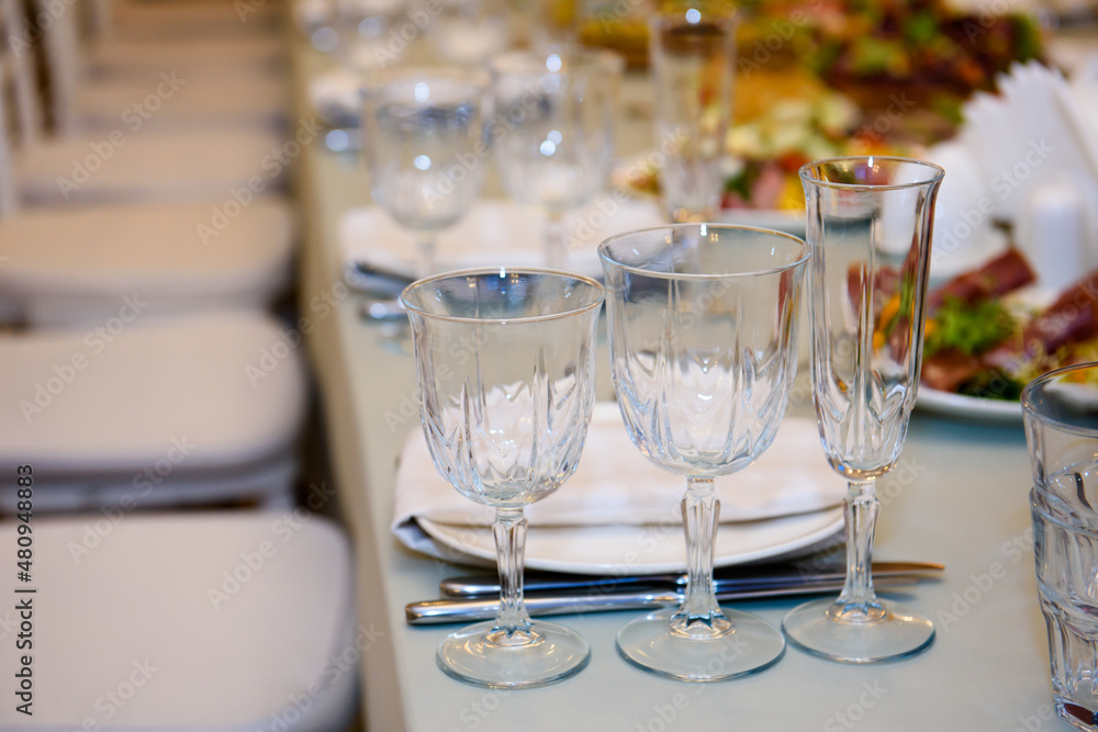 Fototapeta premium Banquet table served for guests. Cutlery and food at the reception party.