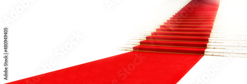 Staircase with red carpet, illuminated by light