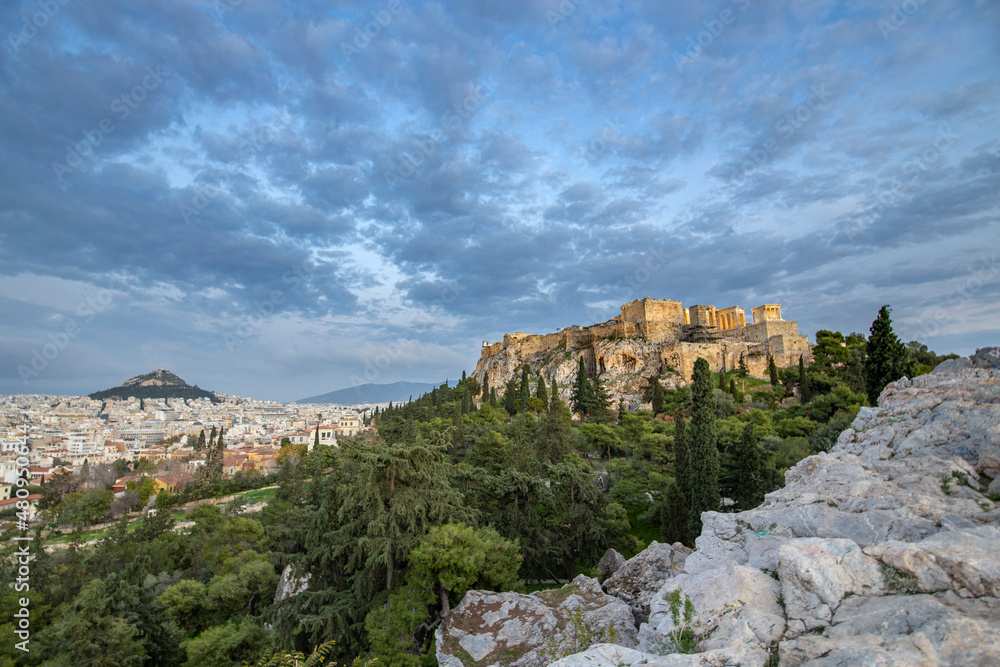View of the city of Athens November 17, 2021: Evening landscape, blue sky with clouds, soft light. Picturesque view from the hill to the old town. View of the city of Athens November 17, 2021: Evening landscape, blue sky with clouds, soft light. Picturesque view from the hill to the old town.