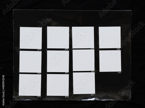 real macro photo of black and white hand copy contact sheet with 11 empty film frames. 120mm medium format film photo placeholder. photo