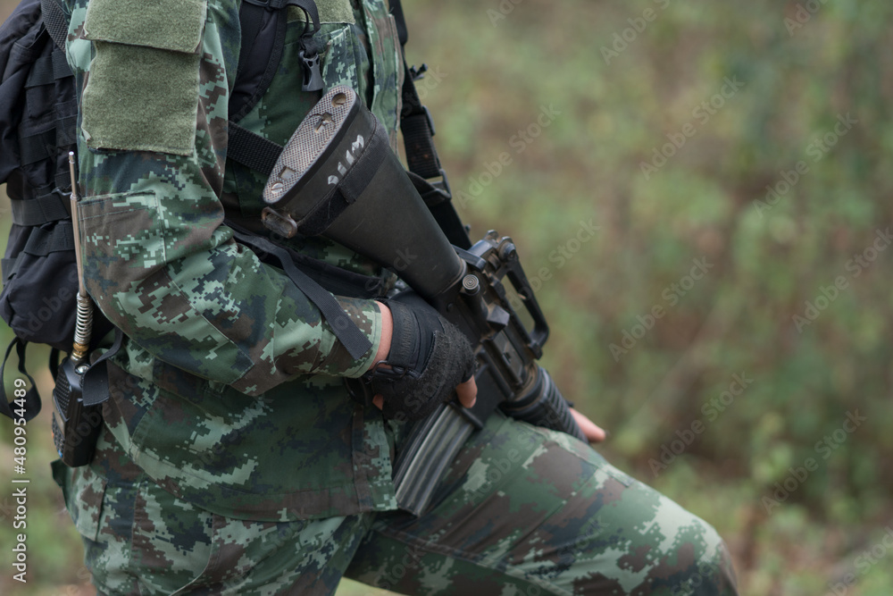 close up soldiers with gun.