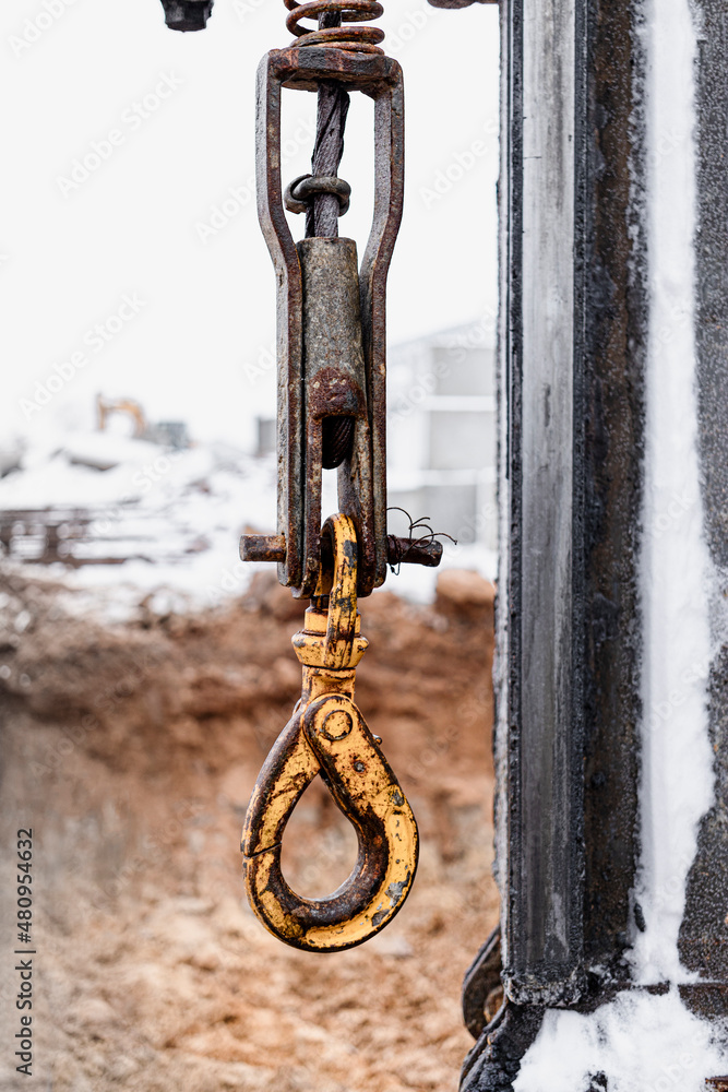 Powerful pile driving rig at the construction site. Lifting winch of a ...