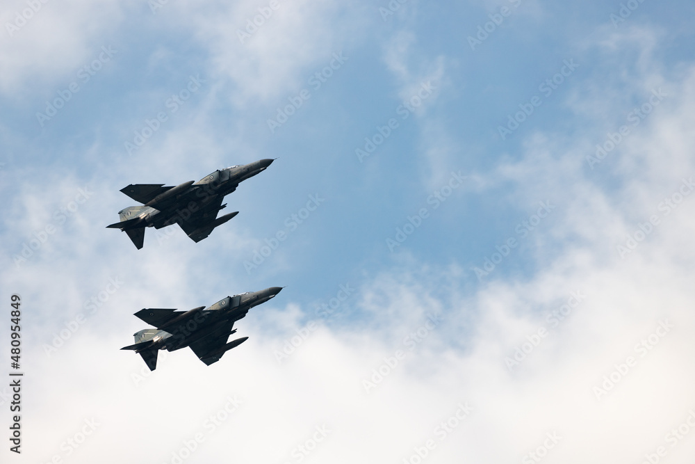 Two tactical air supersonic fighter bomber in the service of the Greek Air Force. War conflict and defense forces concept - obrazy, fototapety, plakaty 