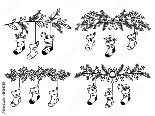 Set of Christmas stockings hanging on fir branch. Collection of holiday stylized winter socks with ornaments and presents. Vector illustration of festive freehand drawing.