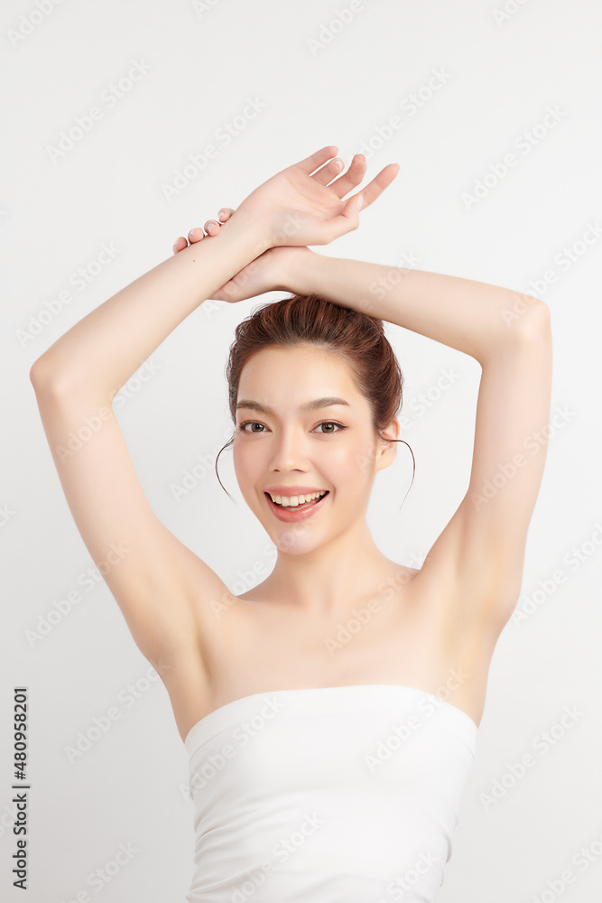 Beautiful Young Asian woman lifting hands up to show off clean and hygienic armpits or underarms on white background, Smooth armpit cleanliness and protection concept Beautiful Young Asian woman lifting hands up to show off clean and hygienic armpits or underarms on white background, Smooth armpit cleanliness and protection concept