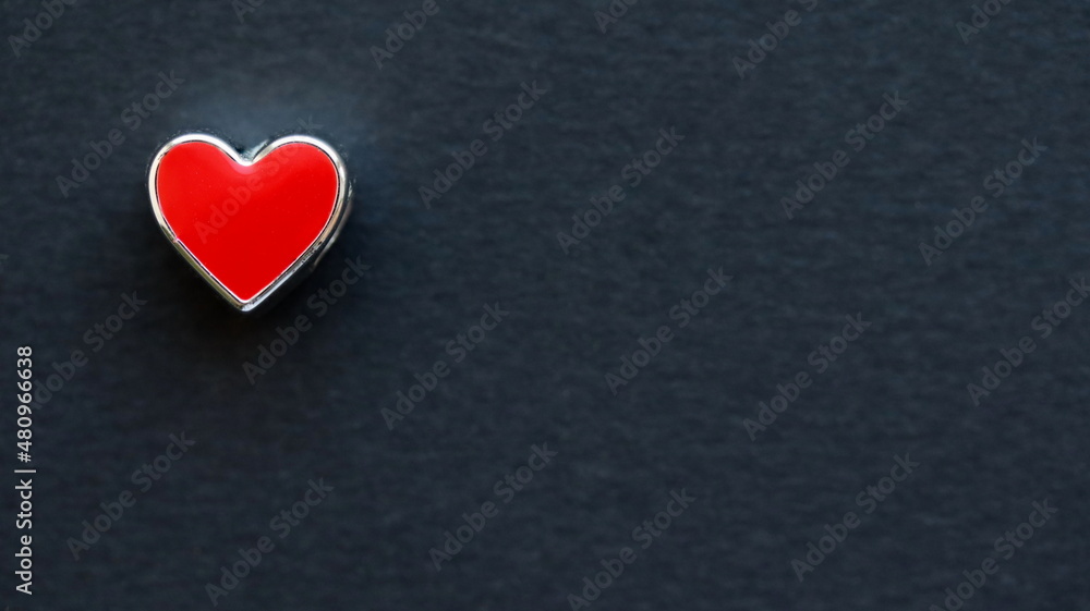 Red heart isolated on black background. Top view, flat lay. Space for text. Red heart isolated on black background. Top view, flat lay. Space for text.
